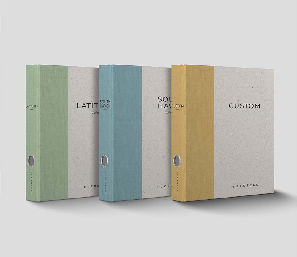 Three brand binders with the titles Latitudes, South Haven, and Custom on the front.